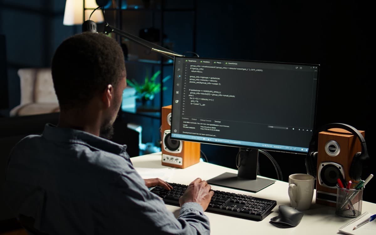 Developer analysing data at a desktop workstation