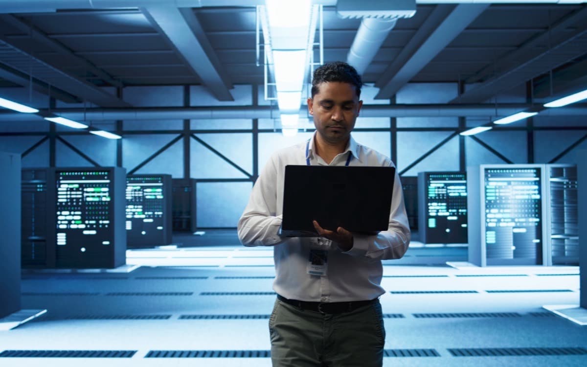 Technician working on servers in a data centre