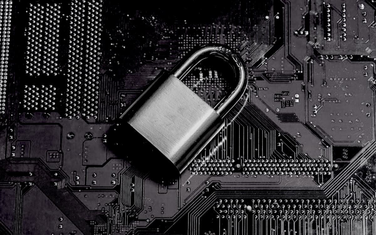 Padlock resting on a computer circuit board